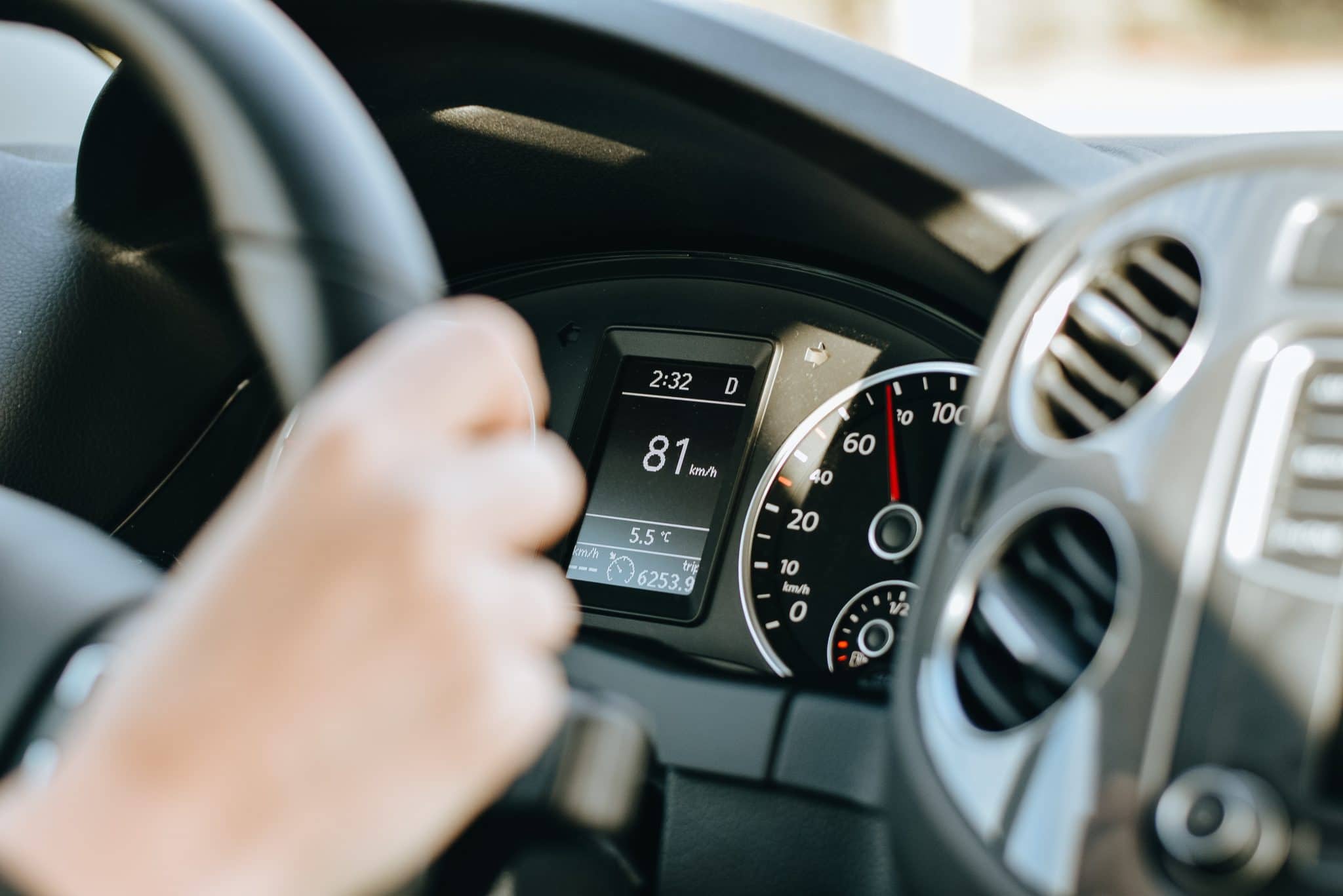 a picture of a person driving a car