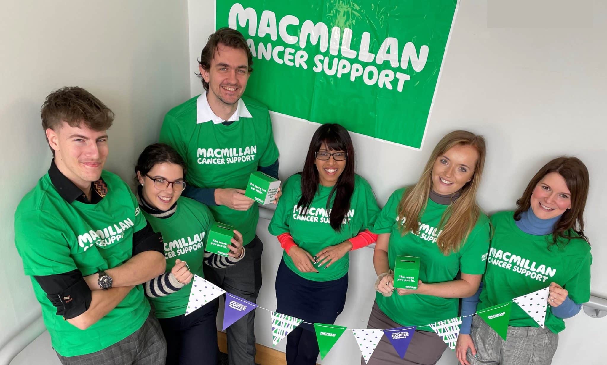Parsons employees pose wearing green Macmillan Cancer Support t-shirts