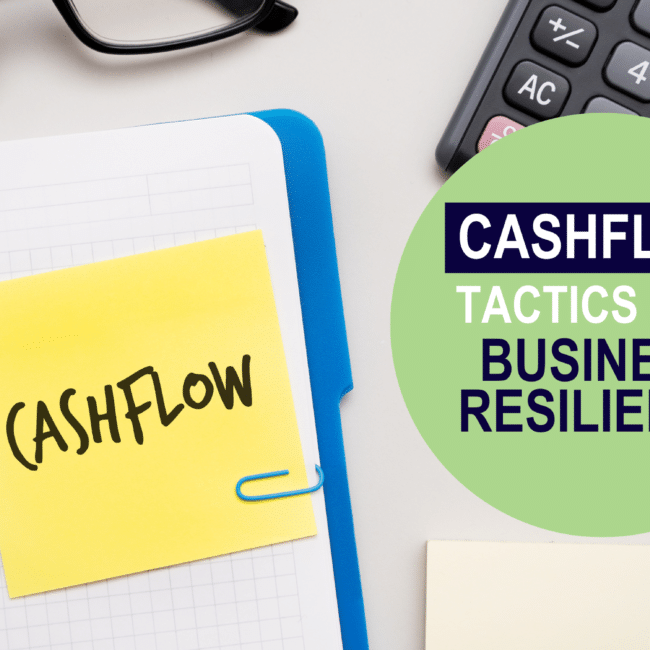 Notebook open on a desk with 'cashflow' written in it