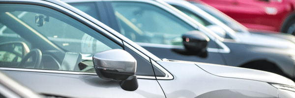 A close-up of cars parked in a row