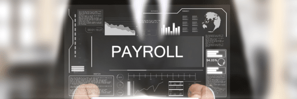 a man holds a screen labelled 'PAYROLL'